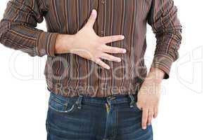 man holding his stomach in pain or indigestion