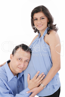 Portrait of a happy young pregnant woman with her husband