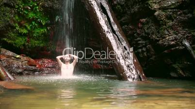 caucasian man enjoying in waterfall