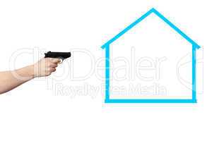 Hand holding gun in the direction of symbolic house