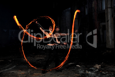 Woman holds in his hand the fire