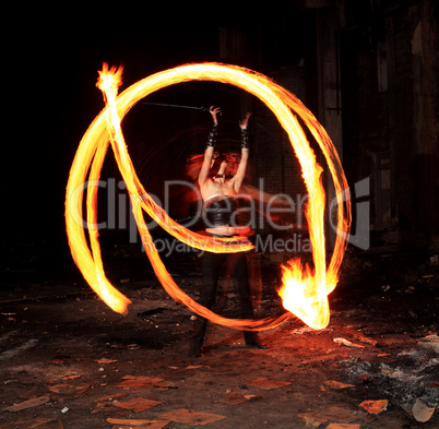 Woman holds in his hand the fire