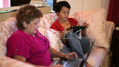 Mother daughter using tablet computer