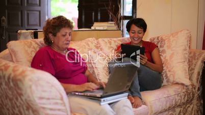 Mother daughter using tablet computer