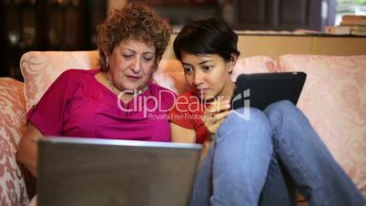 Mother daughter using tablet computer