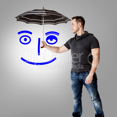 Man holding umbrella over symbolic face