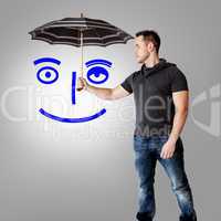 Man holding umbrella over symbolic face