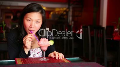 Asian young woman drink cocktail