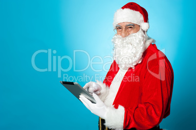 Santa using newly launched electronic tablet device