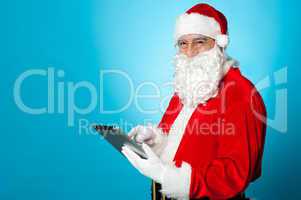 Santa using newly launched electronic tablet device
