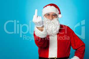 Agitated Santa showing his middle finger