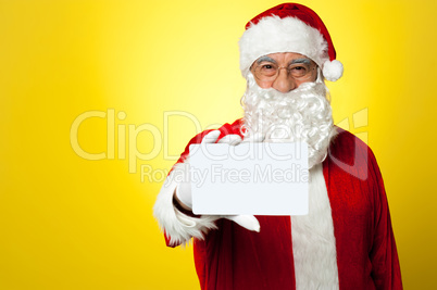 Santa holding blank white placard
