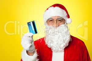 Aged man in Santa clothing ready to shop