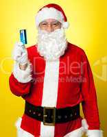 Male in Santa costume posing with his cash card