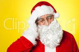 Portrait of Santa Claus suffering from headache