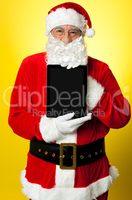 Kris Kringle presenting new updated tablet pc