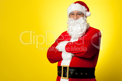 Saint Nick posing confidently against yellow background