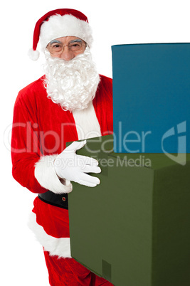 Photo of kind Santa Claus giving xmas presents