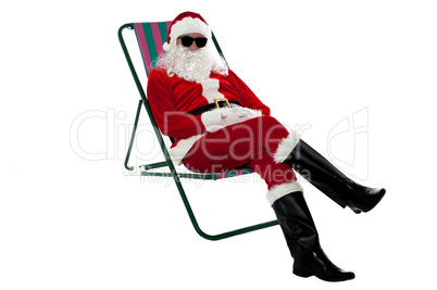 Santa wearing shades and striking stylish pose