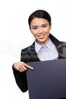 Asian businesswoman pointing to a board