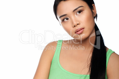 Thoughtful young Asian woman