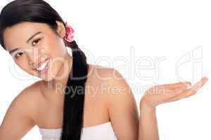Beautiful smiling woman holding out her palm