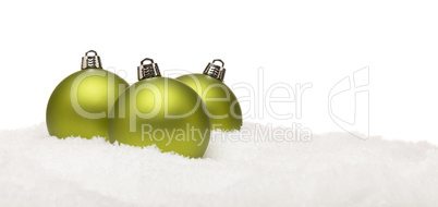 Green Christmas Ornaments on Snow Flakes Isolated on White