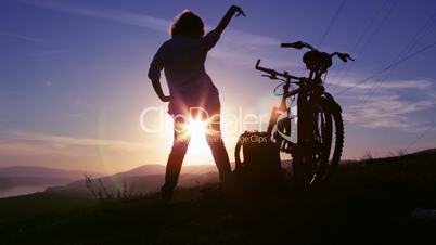 Mountain biker sunset silhouette