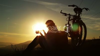 Mountain biker, sunset silhouette