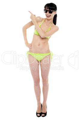 Attractive woman in green bikini being expressive