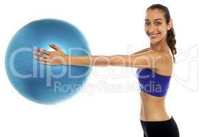 Fitness enthusiast holding a swiss ball