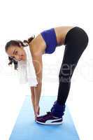 Fit woman bending over and touching her toes