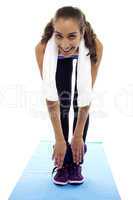 Flexible woman bending down till toes