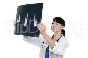 Cheerful female doctor reviewing patients x-ray report
