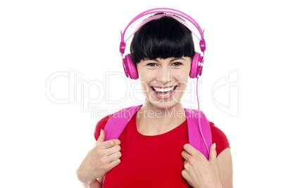 Young girl listening to music, using headphones