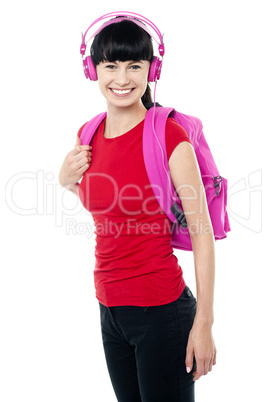 College teen dressed in casuals enjoying music