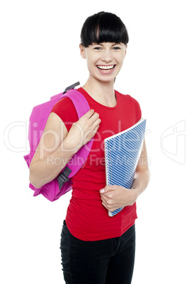 Charming young teenage girl ready to attend college