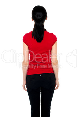 Shapely woman with her back facing camera
