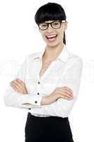 Bespectacled happy woman posing casually