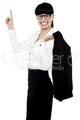 Lively female entrepreneur pointing upwards