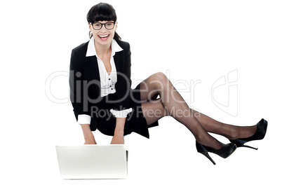 Businesswoman on floor preparing a presentation