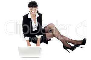 Businesswoman on floor preparing a presentation