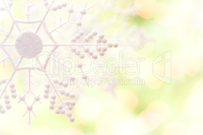 Snowflake Over an Abstract Green and Gold Background