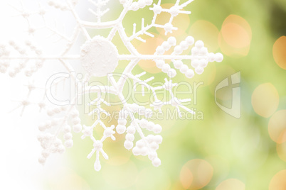 Snowflake Over an Abstract Green and Gold Background