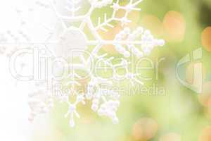 Snowflake Over an Abstract Green and Gold Background