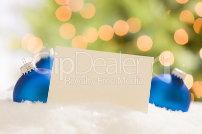 Blue Christmas Ornaments Behind Blank Off-white Card