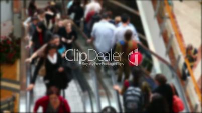 Escalator with people in the mall (no focus)