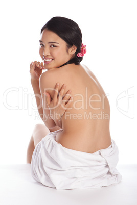Topless Asian girl in a bathrobe