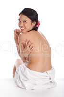 Topless Asian girl in a bathrobe