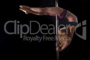 Young pole dance woman in bikini